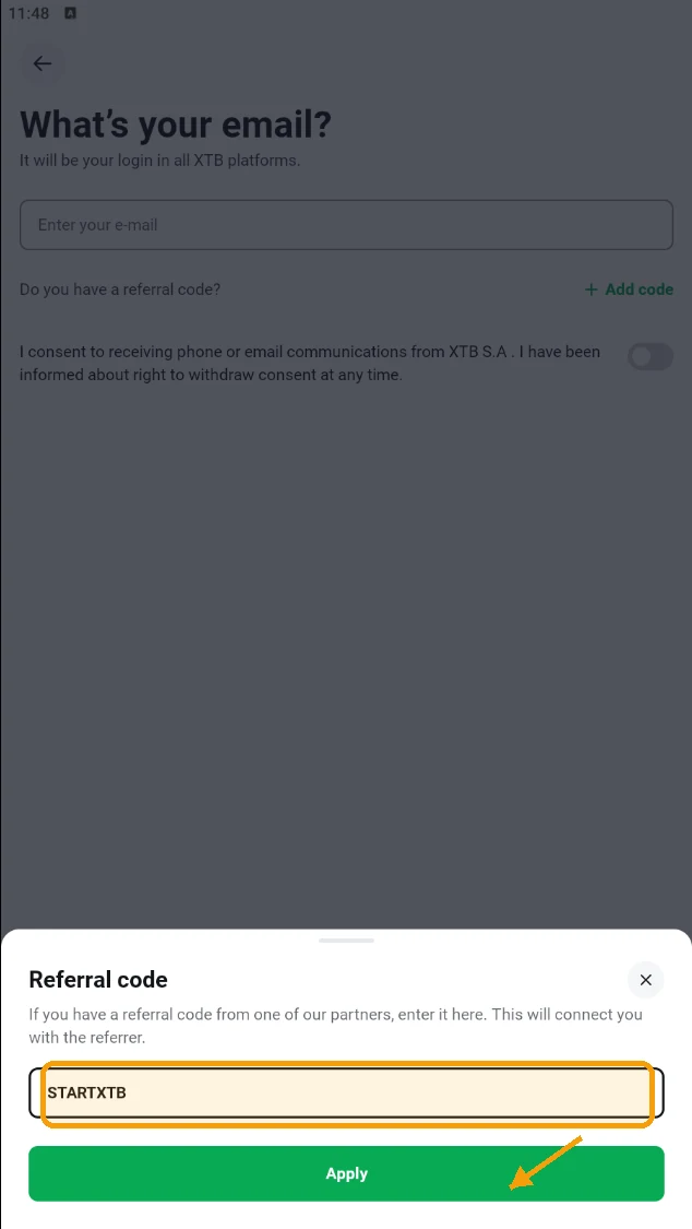 XTB mobile app referral code popup with STARTXTB entered, ready to tap Apply